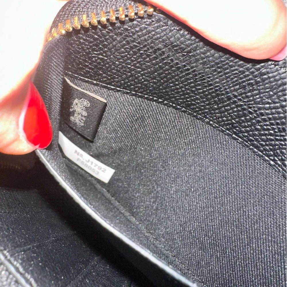Coach wristlet zip around black pebble wallet